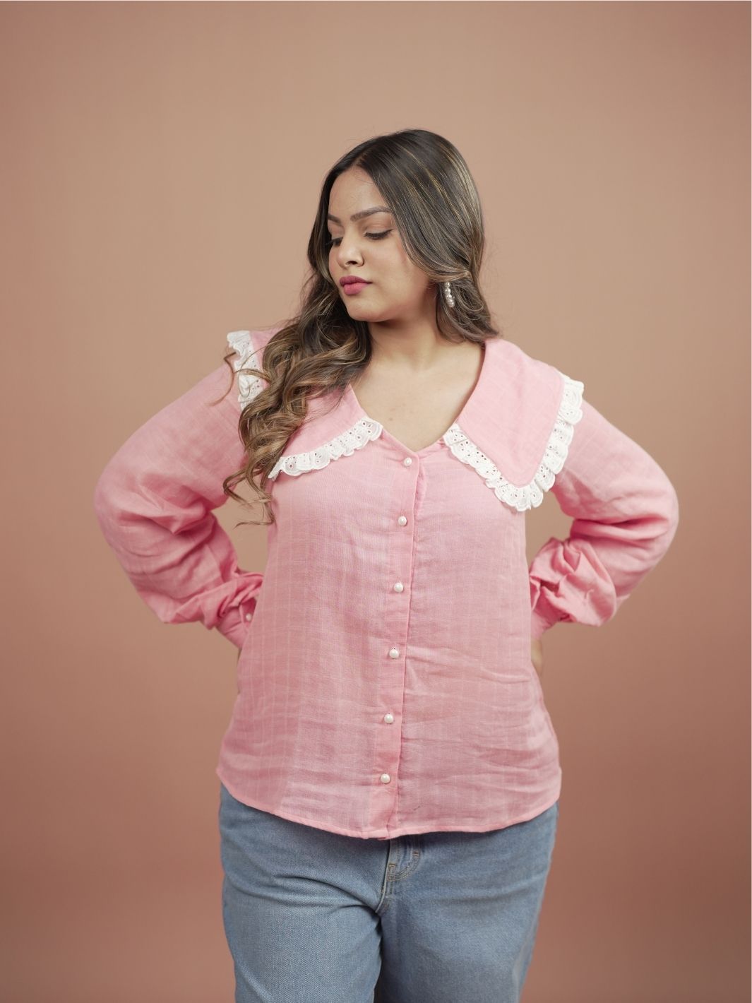 Blossom Pink Ruffle Shirt for Women featuring stylish ruffle sleeves, perfect for summer fashion. This elegant pink blouse is ideal for casual outings or formal occasions, easily paired with skirts, trousers, or jeans for versatile outfit options.