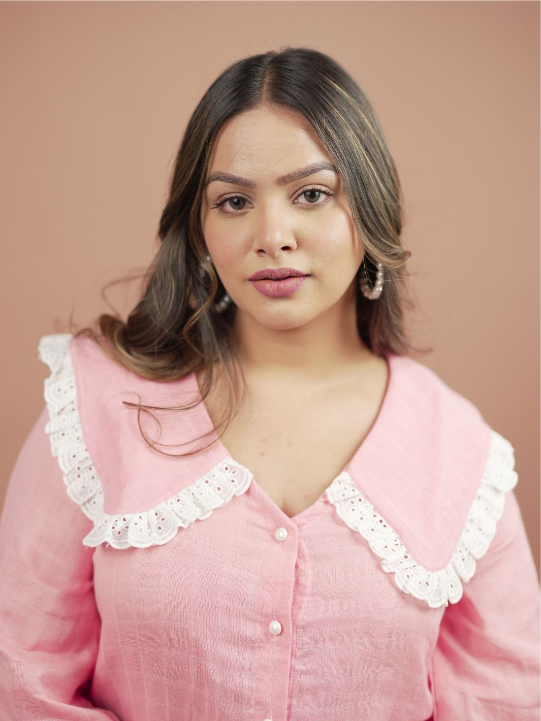 Blossom Pink Ruffle Shirt for Women featuring stylish ruffle sleeves, perfect for summer fashion. This elegant pink blouse is ideal for casual outings or formal occasions, easily paired with skirts, trousers, or jeans for versatile outfit options.