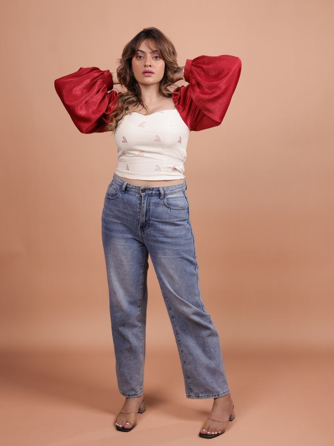 Hearts Red Satin Crop Top featuring a luxurious satin finish, playful heart pattern, and a chic cropped design. Perfect for summer outfits, this versatile crop top can be paired with high-waisted jeans, skirts, or shorts for a trendy look.