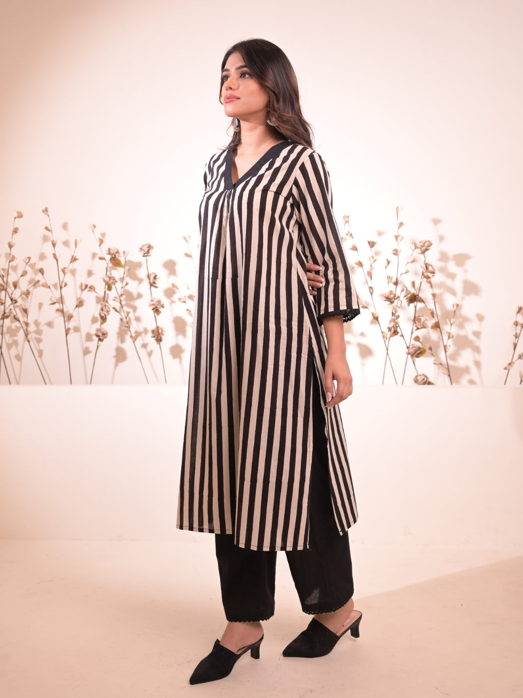 Jasmin Black and White Striped Block Printed Kurta Pant Set featuring a straight kurta and pants with pockets, perfect for stylish everyday wear.